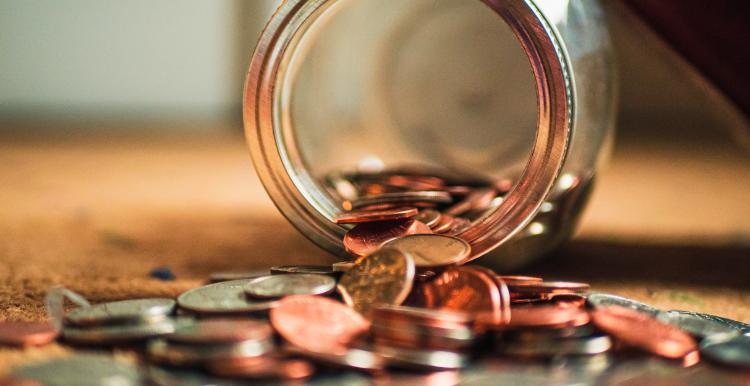 coins spilling from a jar