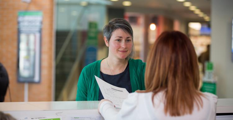 Lady at reception in a health service