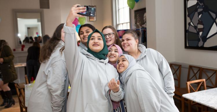 young volunteers taking a group selfie