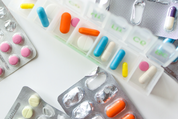 coloured tablets in blister packs
