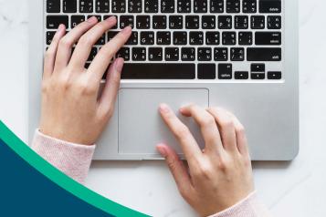 GP websites review front cover with person's hands on laptop keyboard