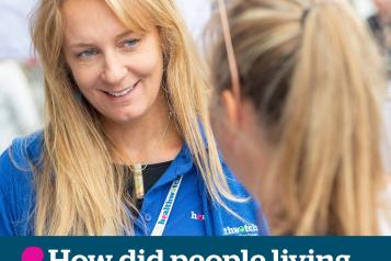 female healthwatch staff member talking to member of the public