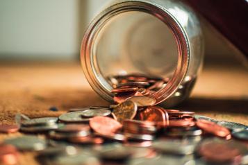 coins spilling from a jar