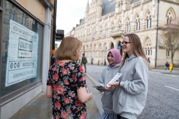 group of women talking in the street