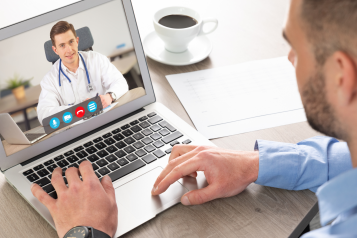 male patient talking to male doctor on a Zoom call