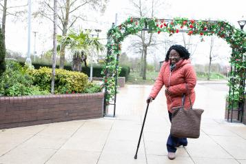 woman walking with stick