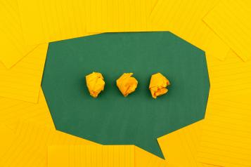 yellow and green paper speech bubble