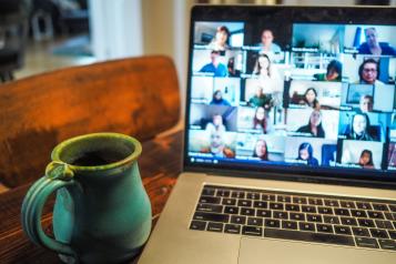 people in a virtual meeting on laptop screen