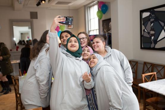 young volunteers taking a group selfie