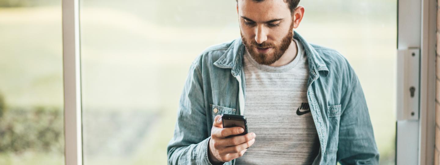 man looking at phone