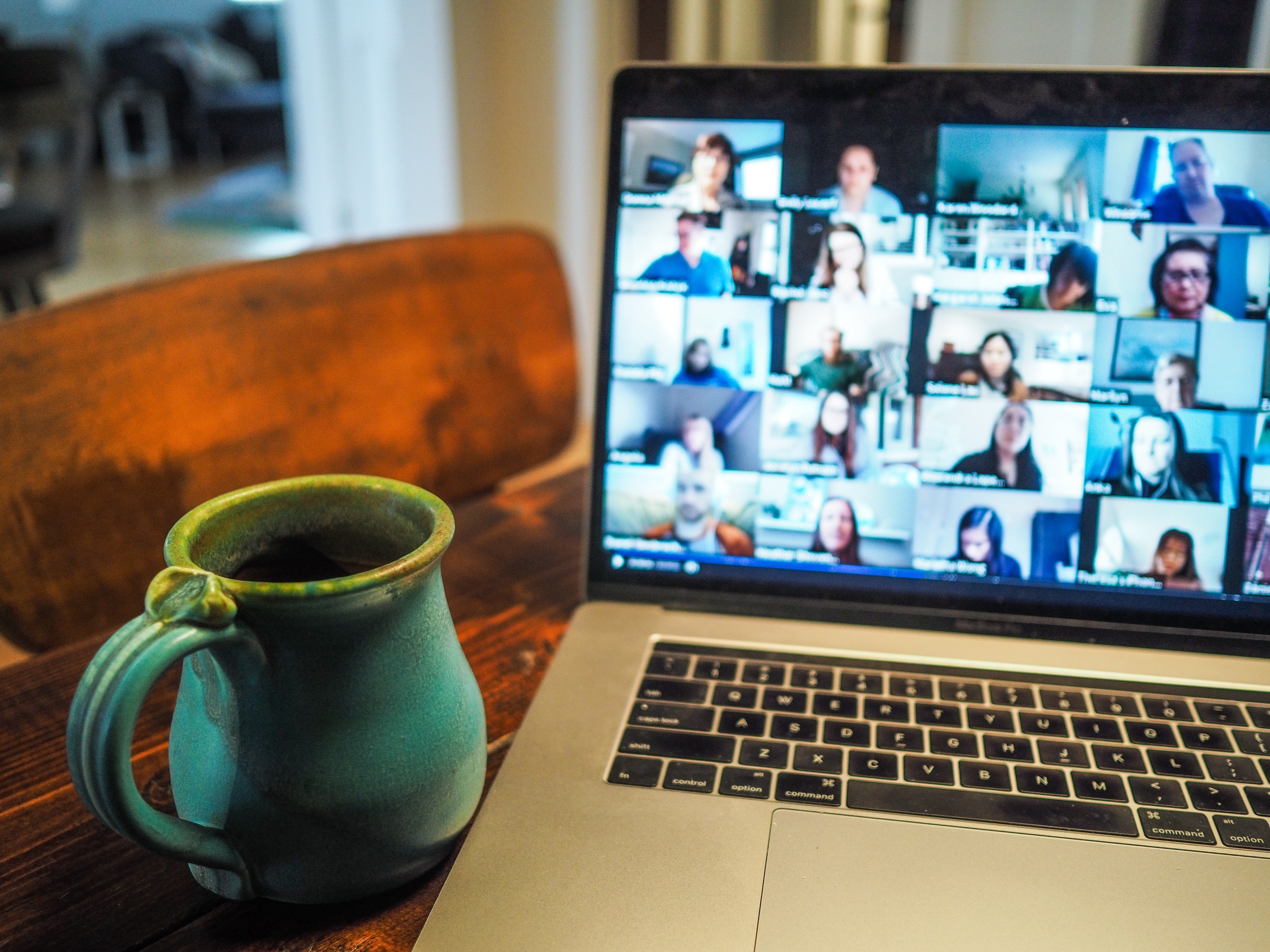 people in a virtual meeting on laptop screen